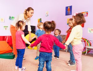 Early childhood education degree teacher teaching a class